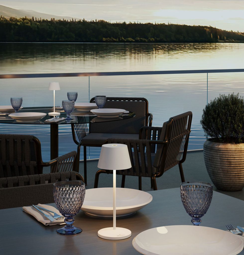 Villeroy & Boch Seoul Micro Matte White USB Rechargeable LED Table Lamps illuminating an outdoor dining setting